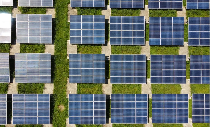 A symmetrical solar panel array on a commercial building